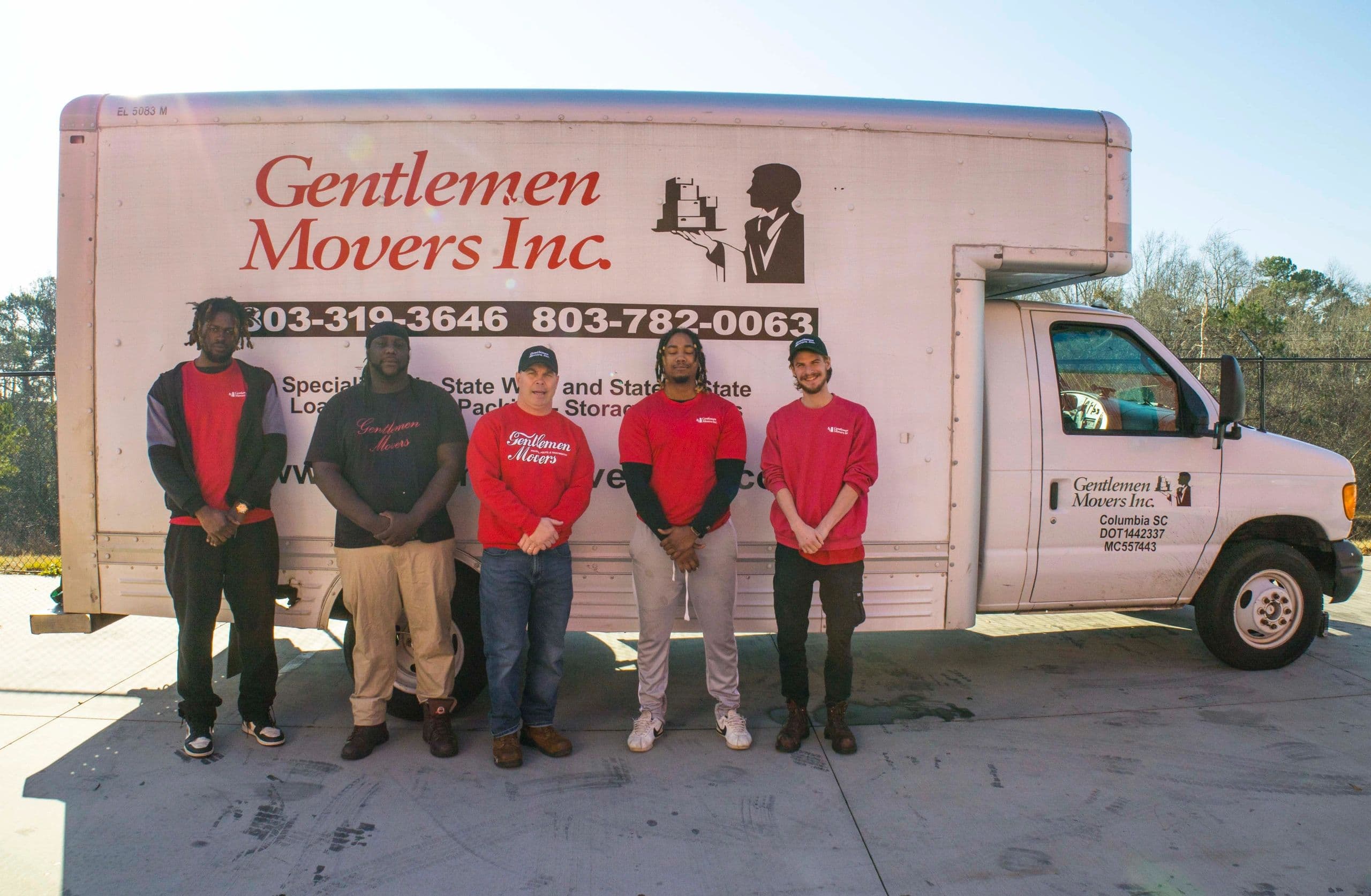 Gentlemen Movers helping a family move into their home